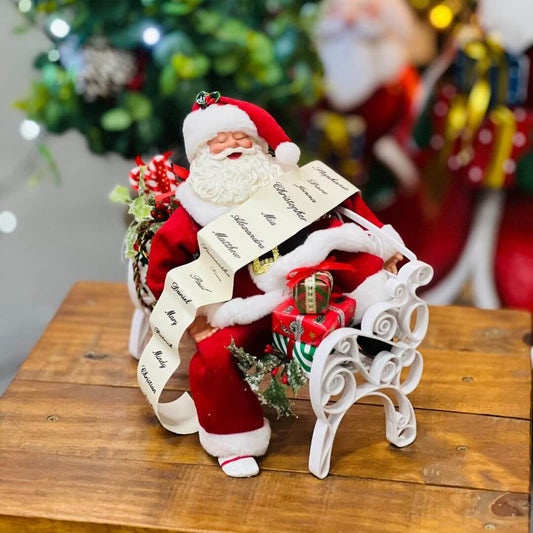 Papai Noel no banco com presentes - 20cm