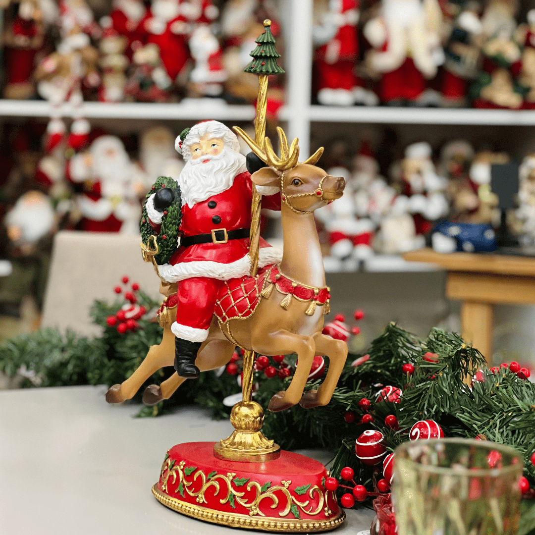 Papai Noel no Carrossel Vermelho de Resina 45,5x28,6cm